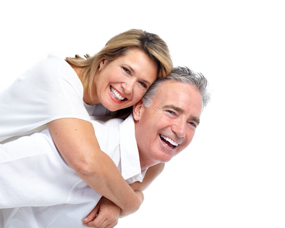 Happy couple with white smiles laughing